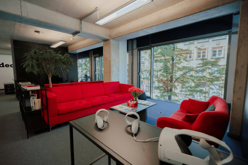 About Jolator AI Workspace Reflecting Jolator AI Mission About Jolator AI workspace with red sofas and VR headsets representing Jolator AI mission in ChatGPT automation